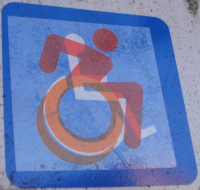 Image of person in a wheelchair in motino