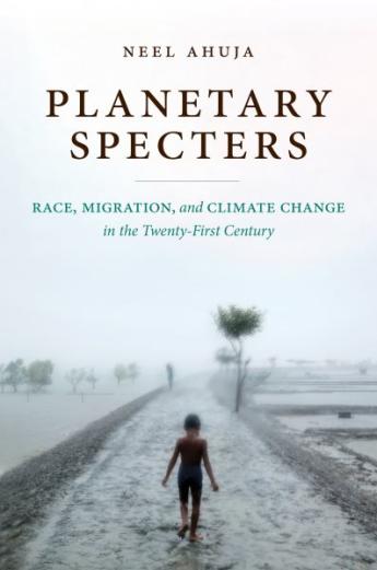 A shadowed figure walks along a long road beneath the title of the book Planetary Specters
